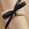 Women Versona Clutching Pearls Bracelet Set